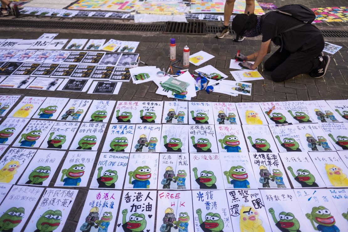 Posters featuring Pepe the Frog are laid out on a sidewalk outside the Central Government Offices during a protest in the Admiralty district of Hong Kong on September 28, 2019. 