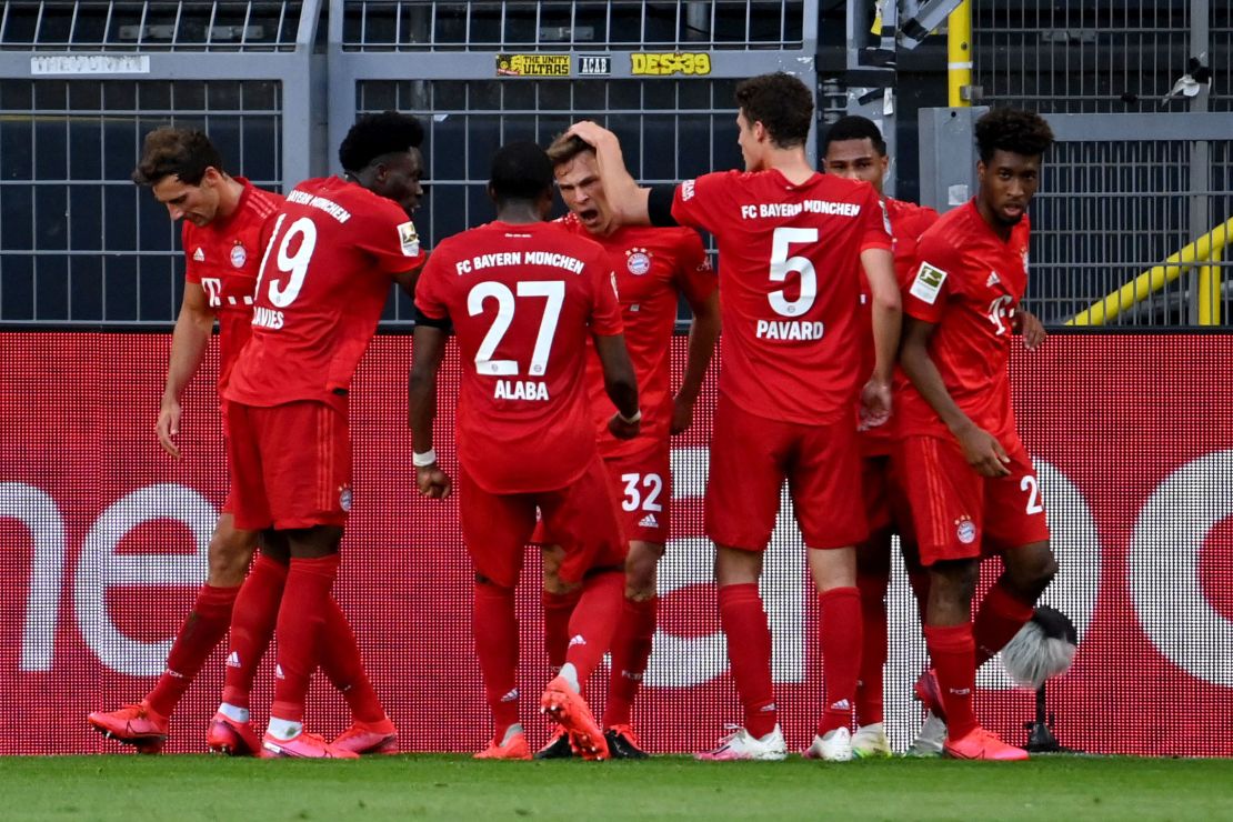Joshua Kimmich (center) celebrates scoring against Borussia Dortmund with his teammates.