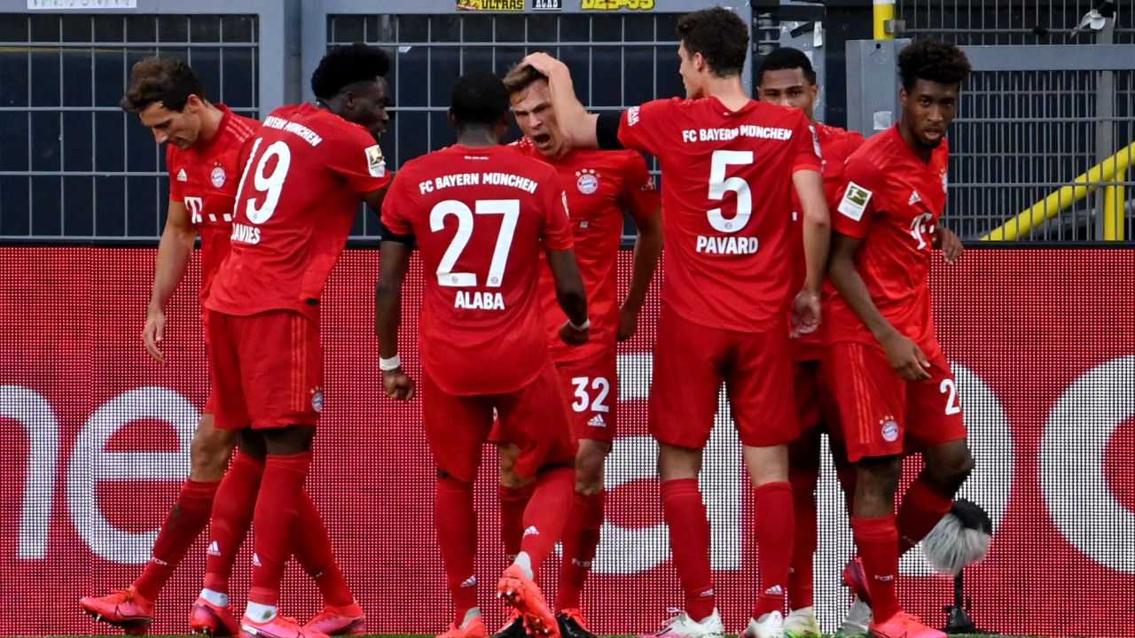 Joshua Kimmich (center) celebrates scoring against Borussia Dortmund with his teammates.