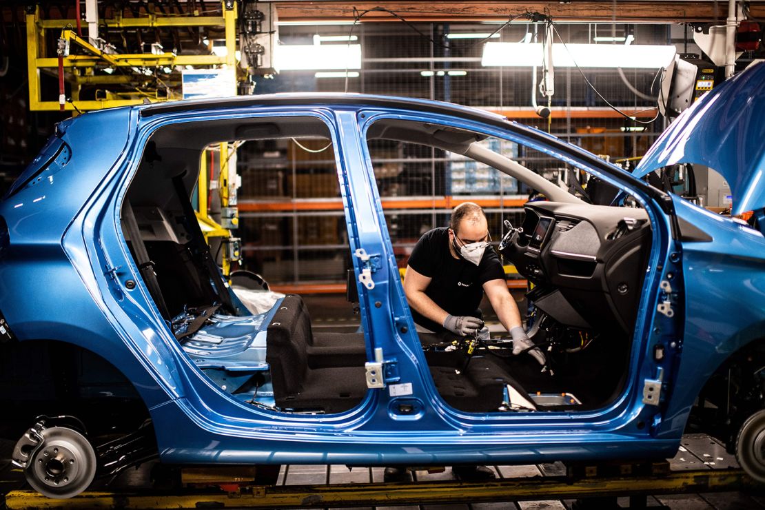 An assembly line near Paris that produces both the electric Renault Zoe and the hybrid Nissan Micra.