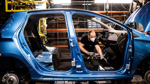 An assembly line near Paris that produces both the electric Renault Zoe and the hybrid Nissan Micra.