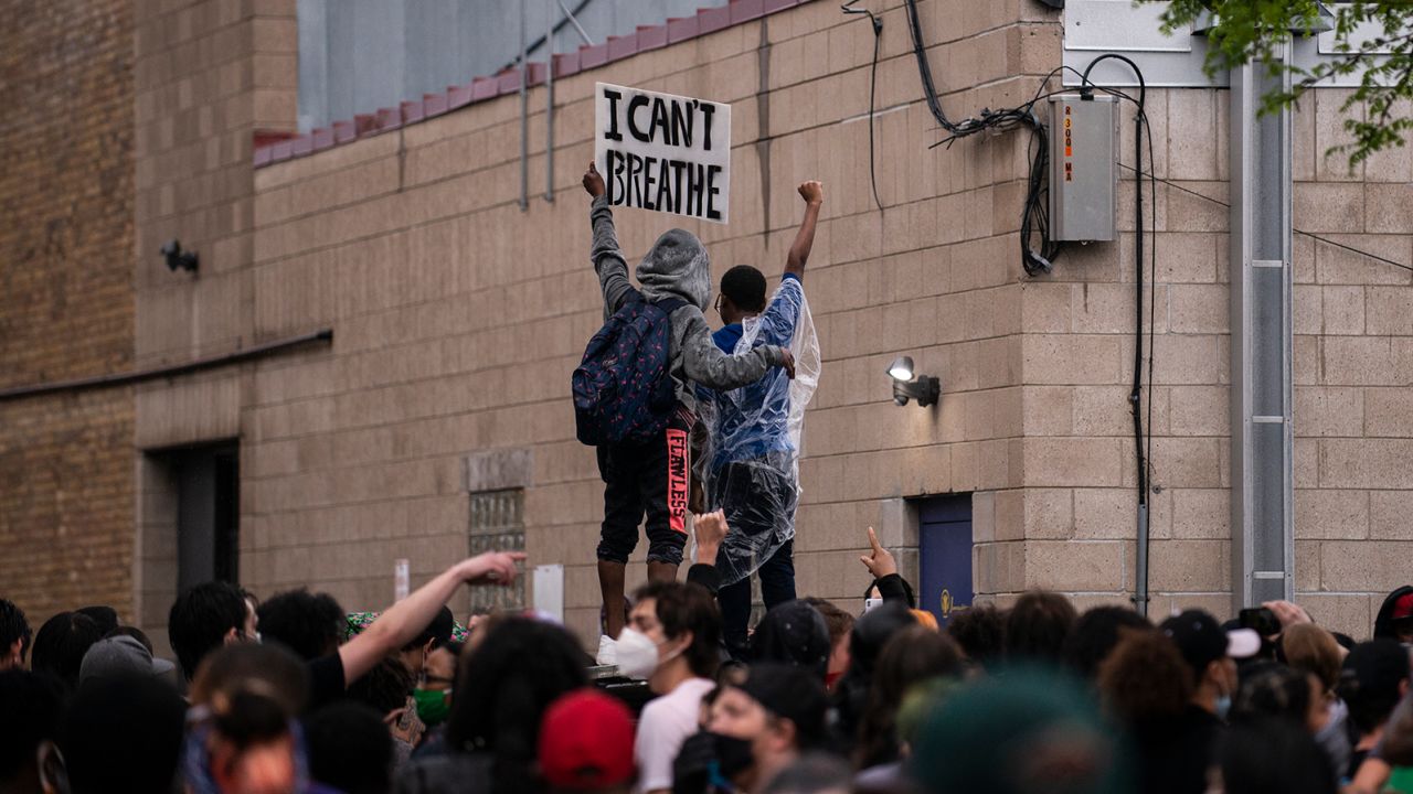 A crowd protests the death of George Floyd outside a police precinct in Minneapolis on Tuesday.