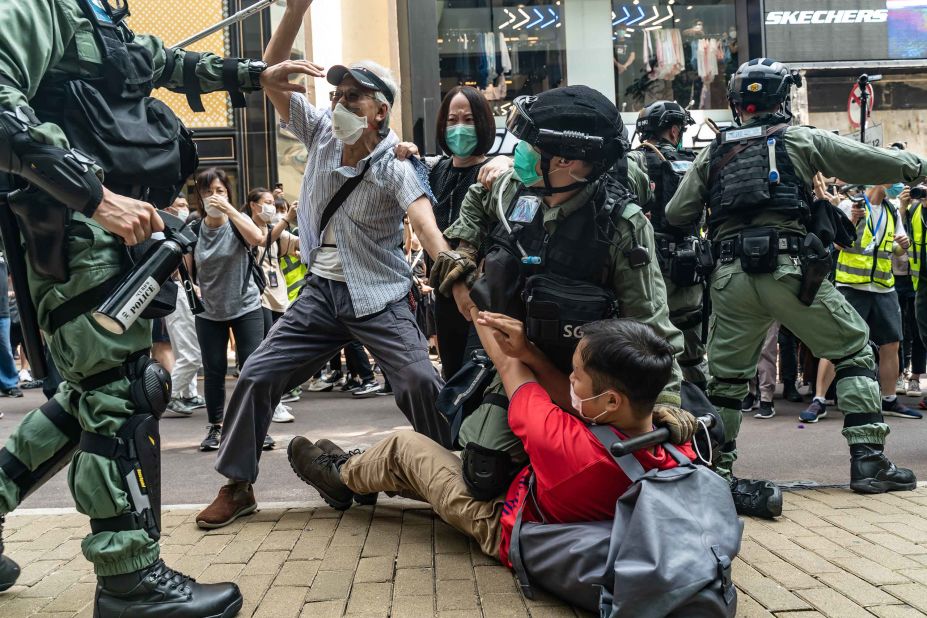 Pro-democracy protesters scuffle with police on May 27.