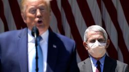 U.S. President Donald Trump is flanked by Dr. Anthony Fauci, director of the National Institute of Allergy and Infectious Diseases while speaking about coronavirus vaccine development in the Rose Garden of the White House on May 15, 2020 in Washington, DC. 
