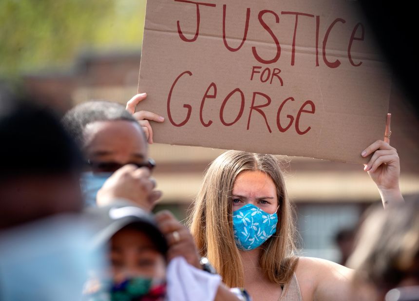 A Minneapolis demonstrator holds a sign reading "Justice for George" on May 26.