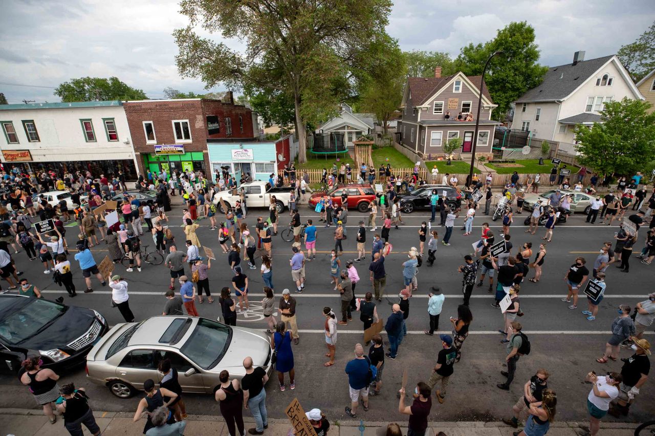 Crowds gather in the street at a protest in Minneapolis on May 26.