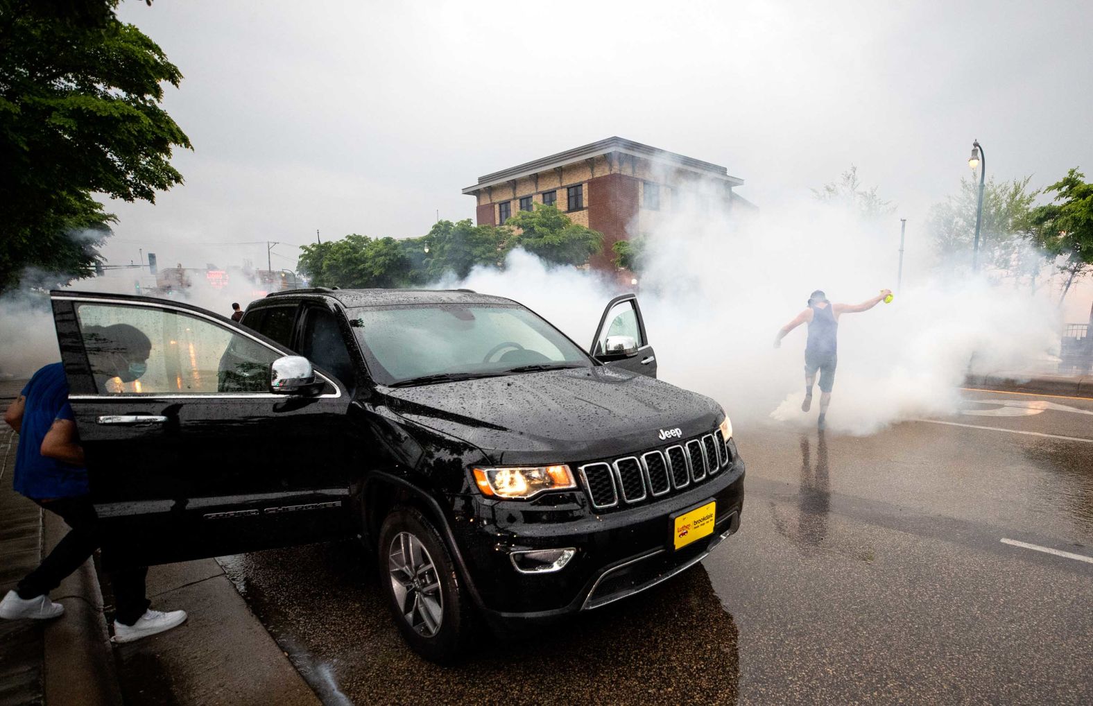 A car in Minneapolis is hit with tear gas on May 26.