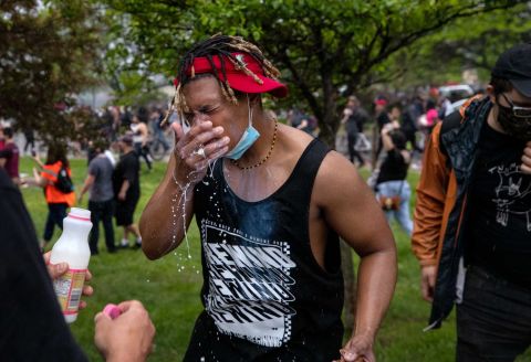 A protester is doused with milk after exposure to tear gas in Minneapolis on May 26.