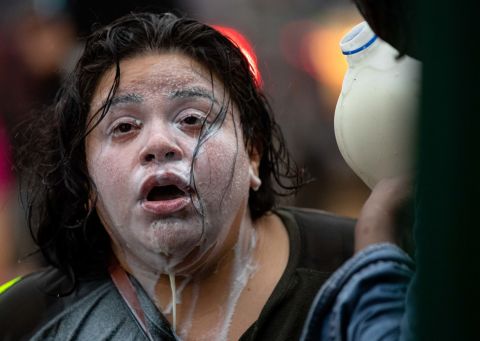 Milk is poured on the face of a protester who had been exposed to tear gas in Minneapolis on May 26.