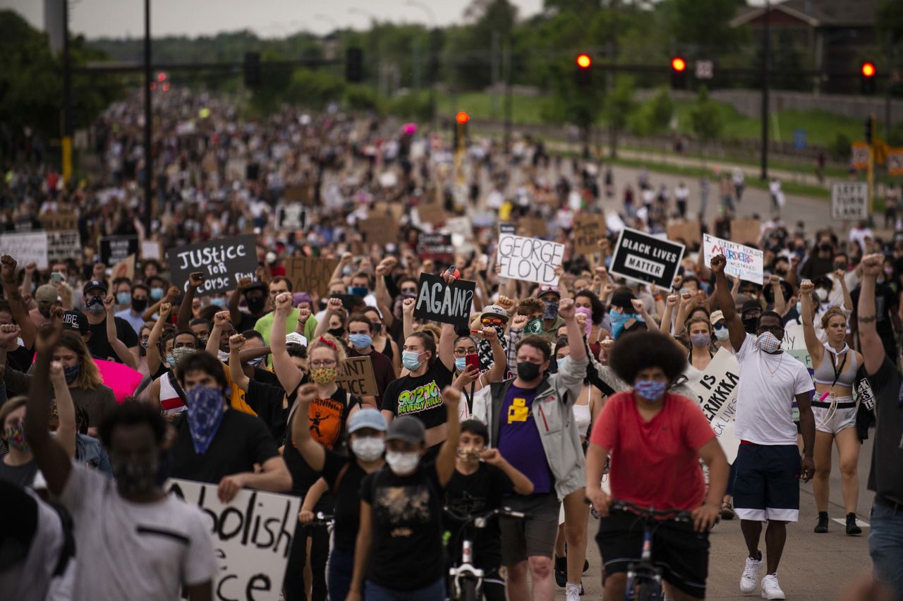 Demonstrators march on Minneapolis' Hiawatha Avenue on May 26.