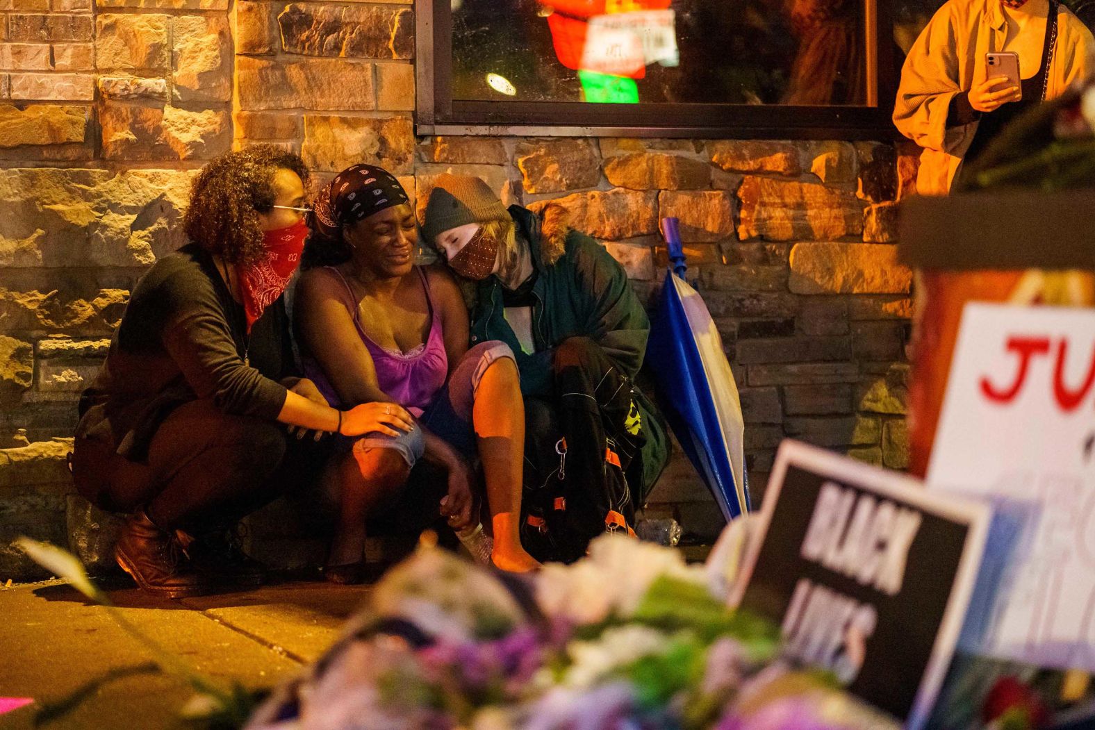 Floyd's girlfriend, Shawanda Hill, is in the center of this photo taken on May 26, near the spot where he died.