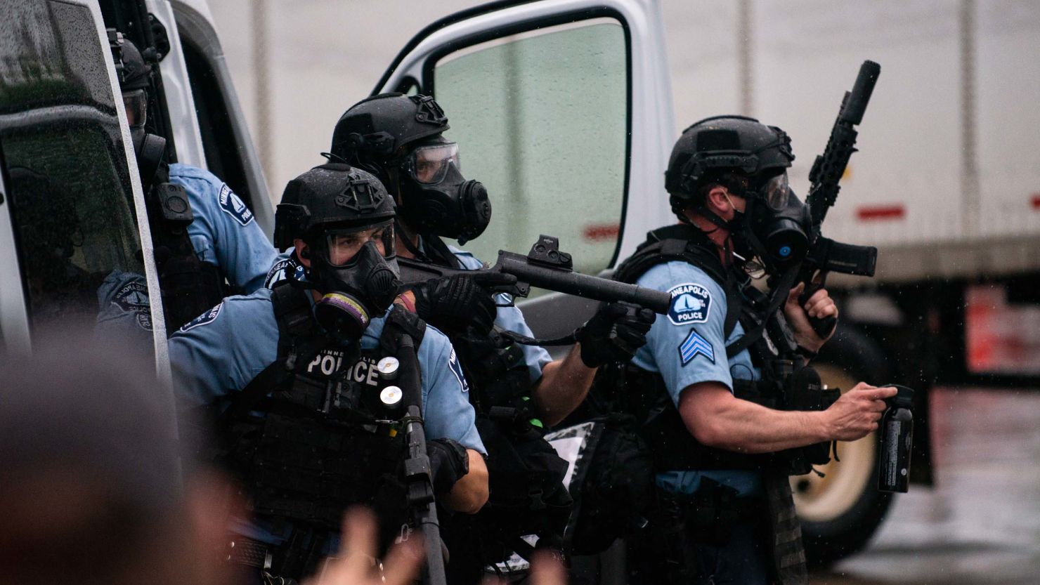 Police dressed in tactical gear attempt to disperse crowds gathered to protest the death of George Floyd outside the 3rd Precinct Police Station on May 26, 2020 in Minneapolis, Minnesota. 