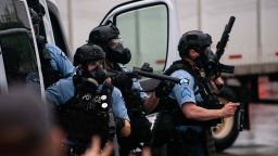 MINNEAPOLIS, MN - MAY 26: Police dressed in tactical gear attempt to disperse crowds gathered to protest the death of George Floyd outside the 3rd Precinct Police Station on May 26, 2020 in Minneapolis, Minnesota. Four Minneapolis police officers have been fired after a video taken by a bystander was posted on social media showing Floyd's neck being pinned to the ground by an officer as he repeatedly said, "I can't breathe". Floyd was later pronounced dead while in police custody after being transported to Hennepin County Medical Center. (Photo by Stephen Maturen/Getty Images)