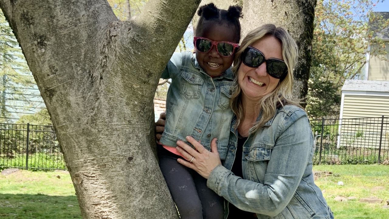 Mary-Jo Sullivan with her adopted daughter, Gracie, from Haiti.