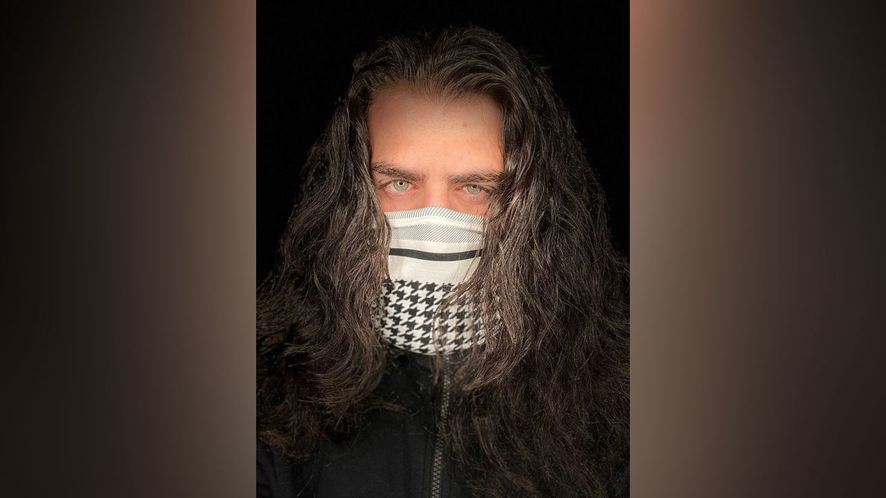 Mohammad Turaani wearing Kadadah's keffiyeh face mask.