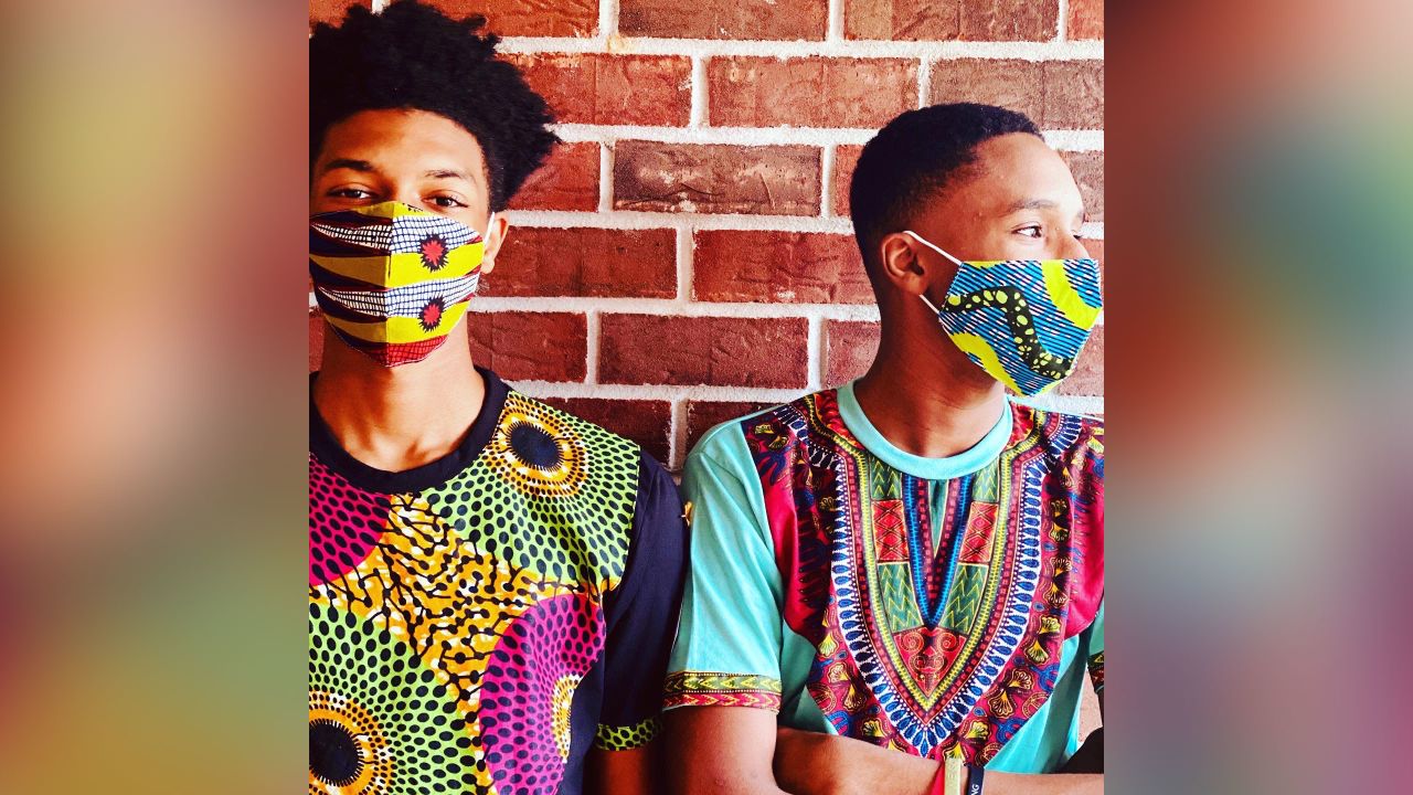 Williams' brother, Ikenna Ware (r), and her son, Kaileb Williams (l), wearing her Ankara print face masks.