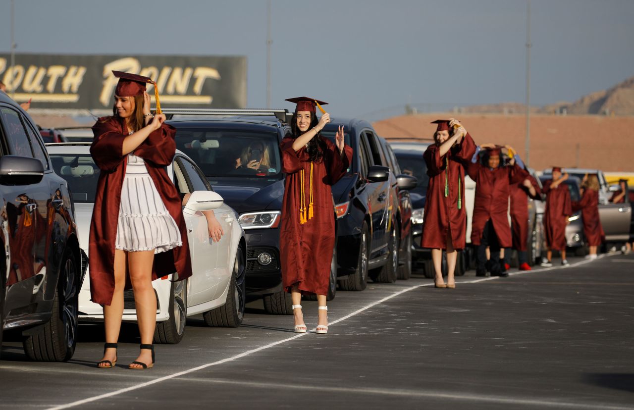 High school graduates turn their tassels during a drive-thru graduation ceremony at the Las Vegas Motor Speedway on May 22.
