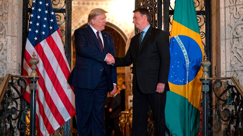 US President Donald Trump (L) shakes hands with Brazilian President Jair Bolsonaro during a diner at Mar-a-Lago in Palm Beach, Florida, on March 7, 2020. (Photo by JIM WATSON / AFP) (Photo by JIM WATSON/AFP via Getty Images)
