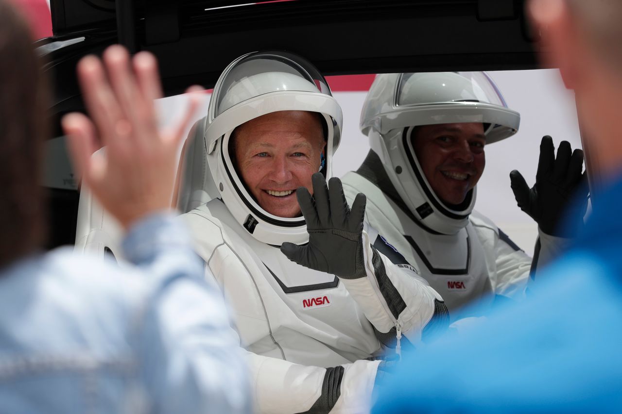 Hurley and Behnken ride a Tesla SUV on their way to the launch pad before the cancellation on May 27.