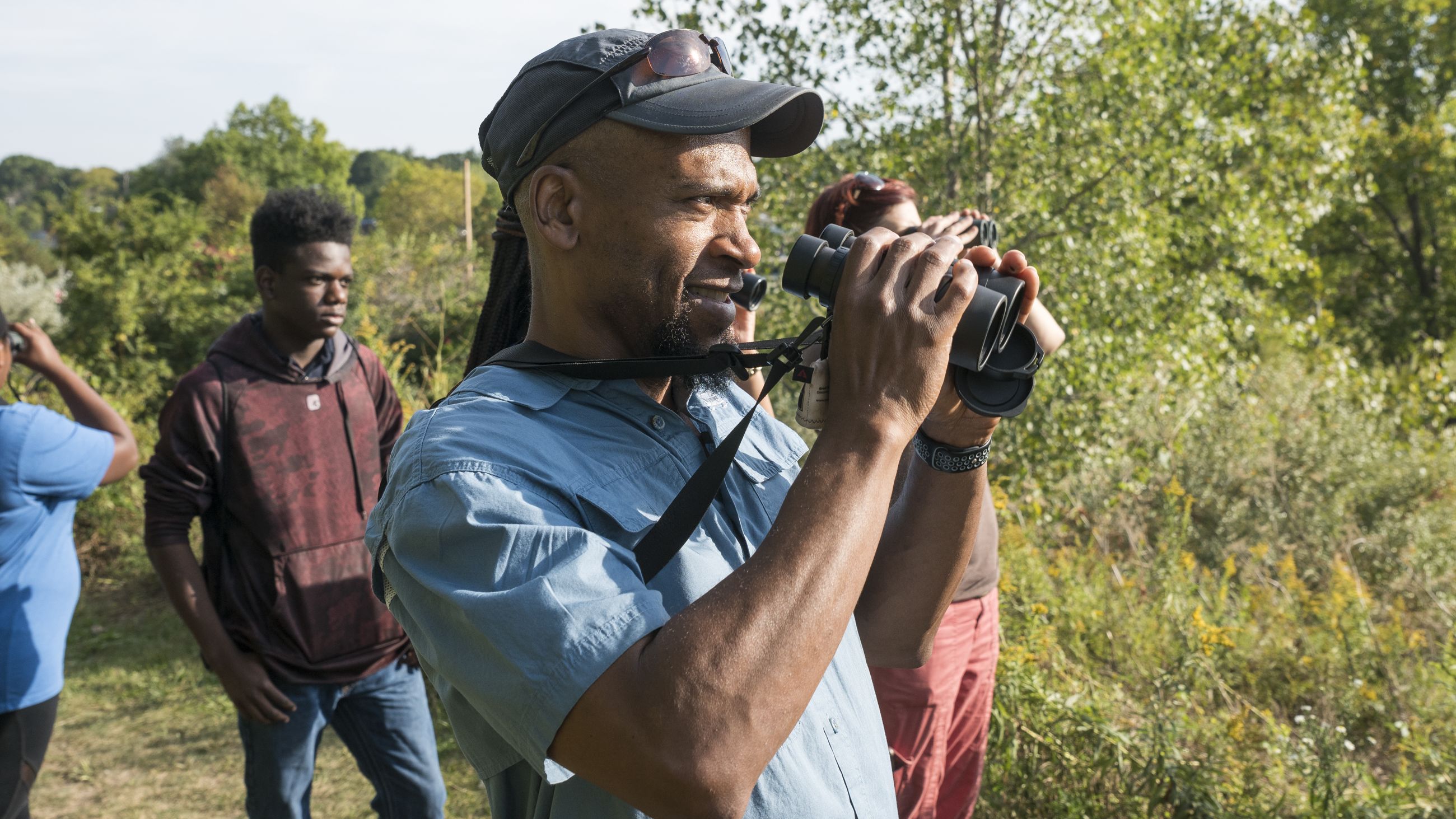 Dudley Edmondson, 58, co-leads a group of Cleveland, Ohio, area students on a nature hike.
