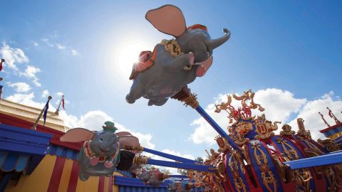 Guests take a spin on Dumbo, the Flying Elephant at Magic Kingdom Park. This signature ride has been with the park since its open in 1971.
