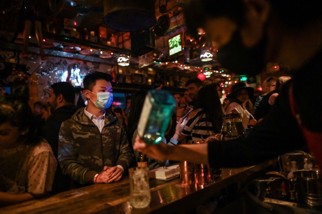 In Shanghai, nightlife staff wear masks and keep bars and clubs disinfected for patrons.