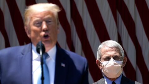 President Donald Trump is flanked by Dr. Anthony Fauci, director of the National Institute of Allergy and Infectious Diseases while speaking about coronavirus vaccine at White House in May.