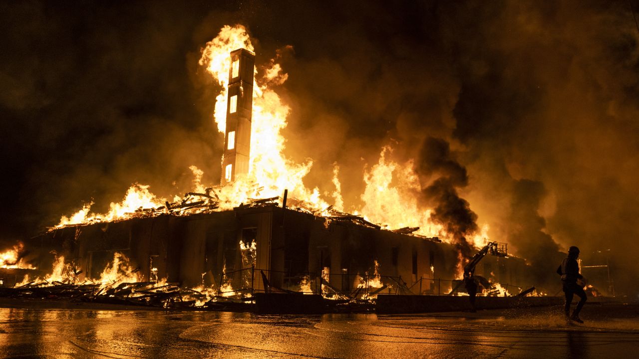 MINNEAPOLIS, MN - MAY 27: A construction site burns in a large fire near the Third Police Precinct on May 27, 2020 in Minneapolis, Minnesota. A number of businesses and homes were damaged as the area has become the site of an ongoing protest after the police killing of George Floyd. Four Minneapolis police officers have been fired after a video taken by a bystander was posted on social media showing Floyd's neck being pinned to the ground by an officer as he repeatedly said, "I can't breathe". Floyd was later pronounced dead while in police custody after being transported to Hennepin County Medical Center. (Photo by Stephen Maturen/Getty Images)