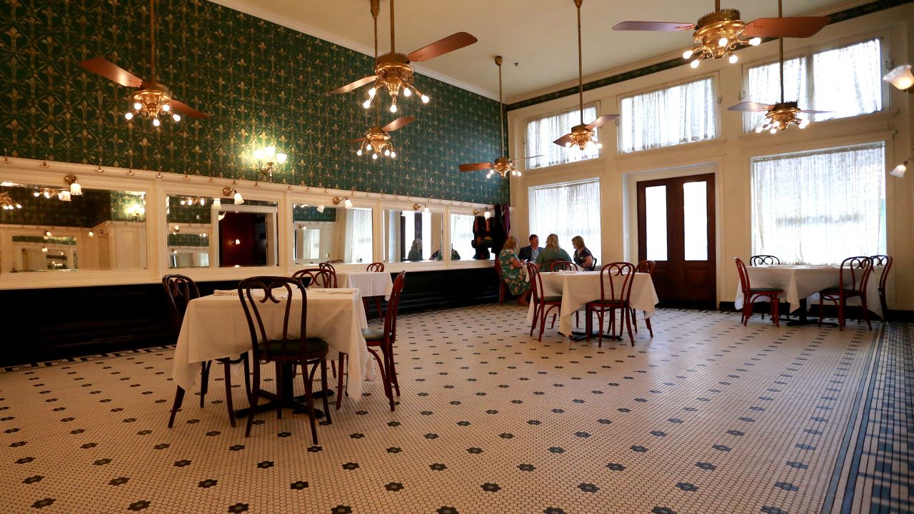 Tables are seen set 6 feet apart at Galatoire's Restaurant in New Orleans, Louisiana.