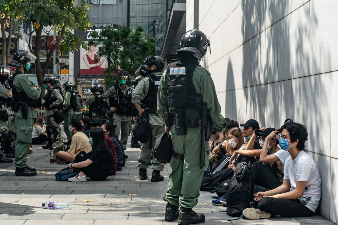 Riot police mass detain pro-democracy protesters during a rally in Causeway Bay district on May 27 in Hong Kong.