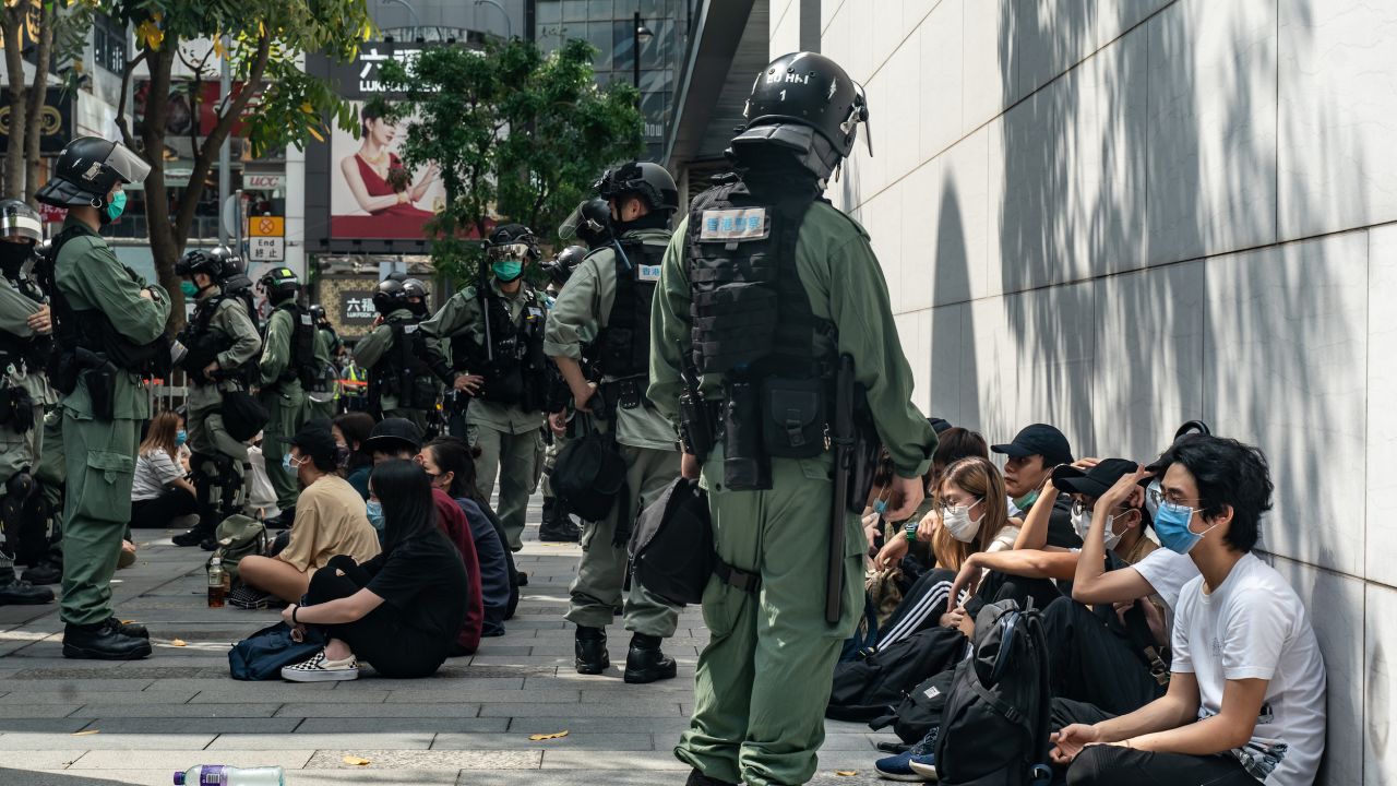 Riot police mass detain pro-democracy protesters during a rally in Causeway Bay district on May 27 in Hong Kong.