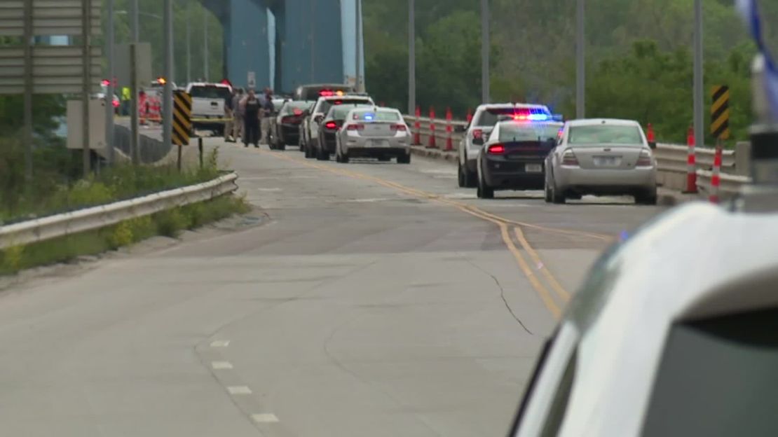 Police work the scene of a shooting on the Centennial Bridge in Leavenworth, Kansas.