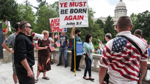 Ben Kennedy, with megaphone, leads dozens of protestors to the Governor's Mansion during the Patriot Day 2nd Amendment Rally at the Kentucky State Capitol Sunday afternoon.