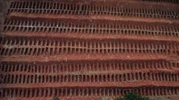 Aerial view of dug graves at the Vila Formosa Cemetery during new coronavirus COVID-19 pandemic, in the outskirts of Sao Paulo, Brazil on May 22, 2020. - Brazil raised its record number of coronavirus deaths over to 20.000, as the pandemic that has swept across the world begins to hit Latin America with its full force. (Photo by NELSON ALMEIDA / AFP) (Photo by NELSON ALMEIDA/AFP via Getty Images)