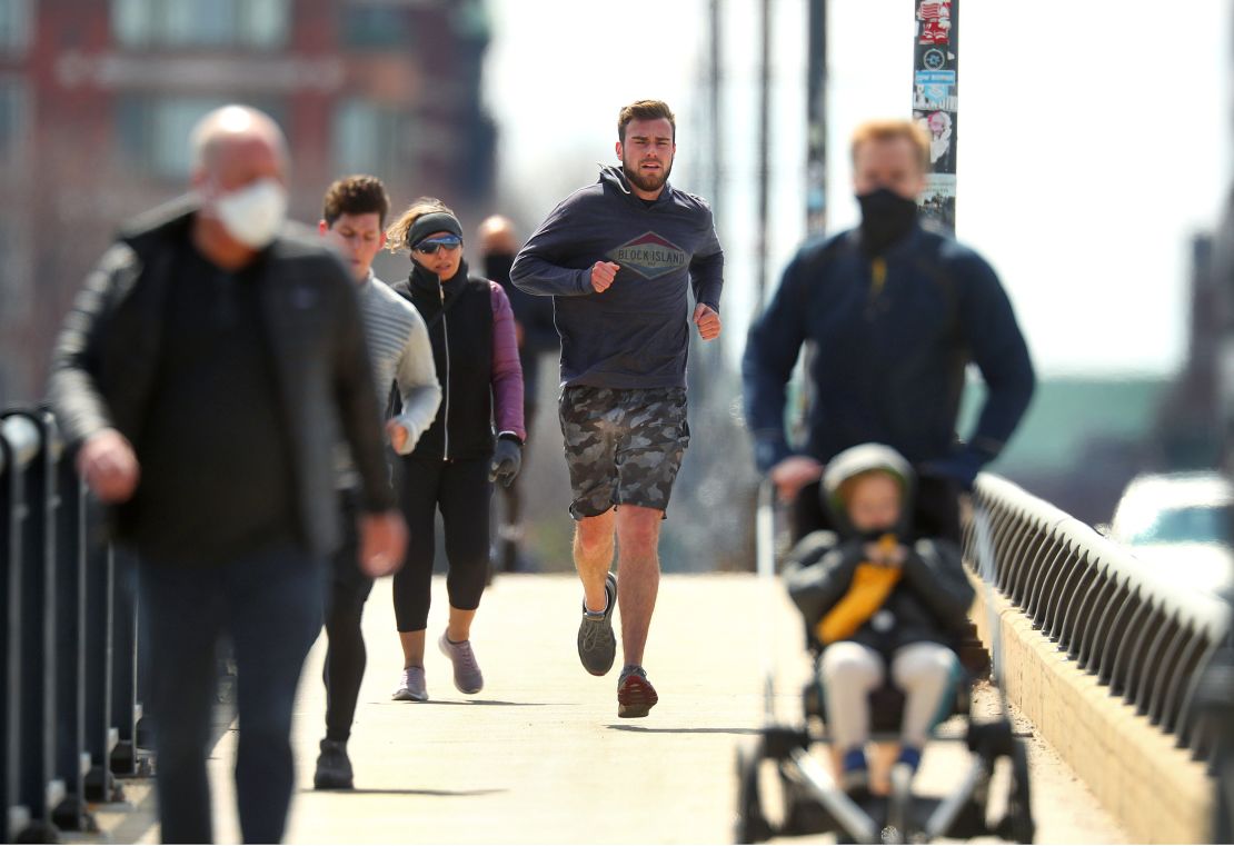 People in Boston go for a run on April 17.