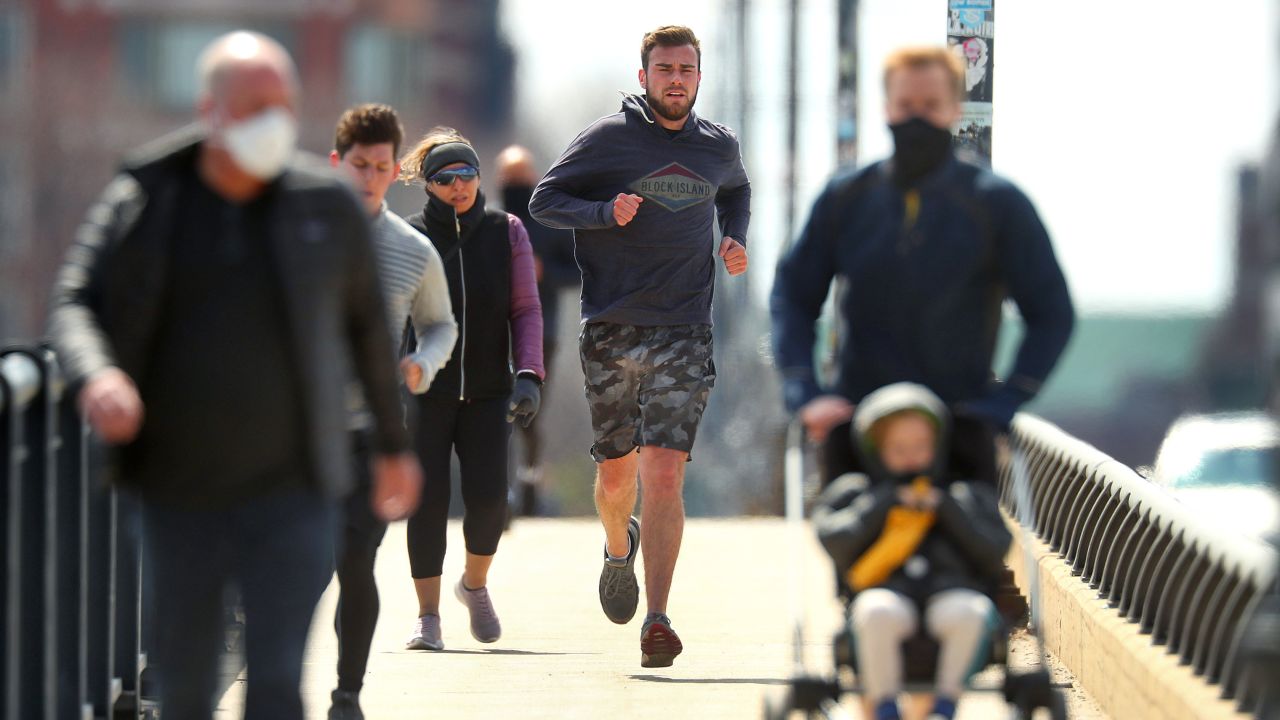 People in Boston go for a run on April 17.
