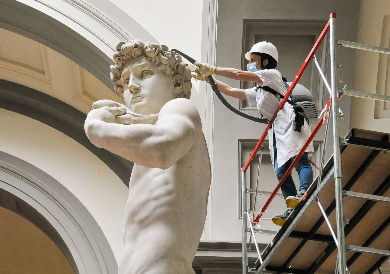 A restorer cleans Michelangelo's David statue on May 27 while preparing for the reopening of the Galleria dell'Accademia in Florence, Italy.