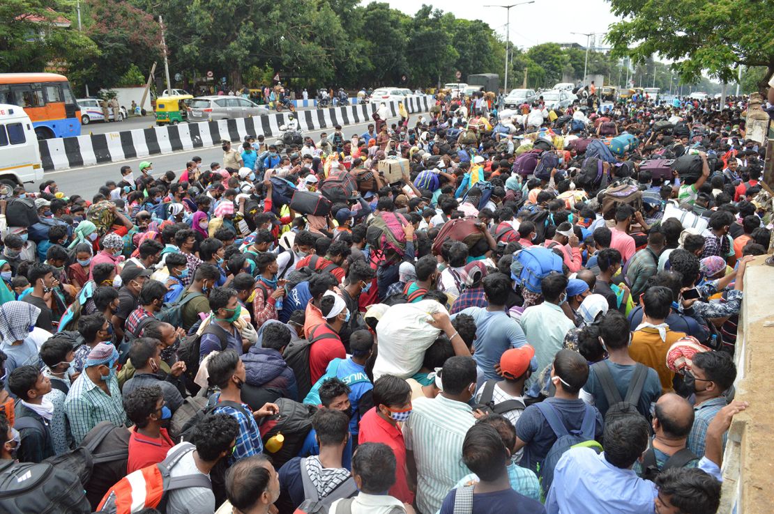 Migrant workers wait to board buses during the coronavirus lockdown in Bengaluru on May 23, 2020.