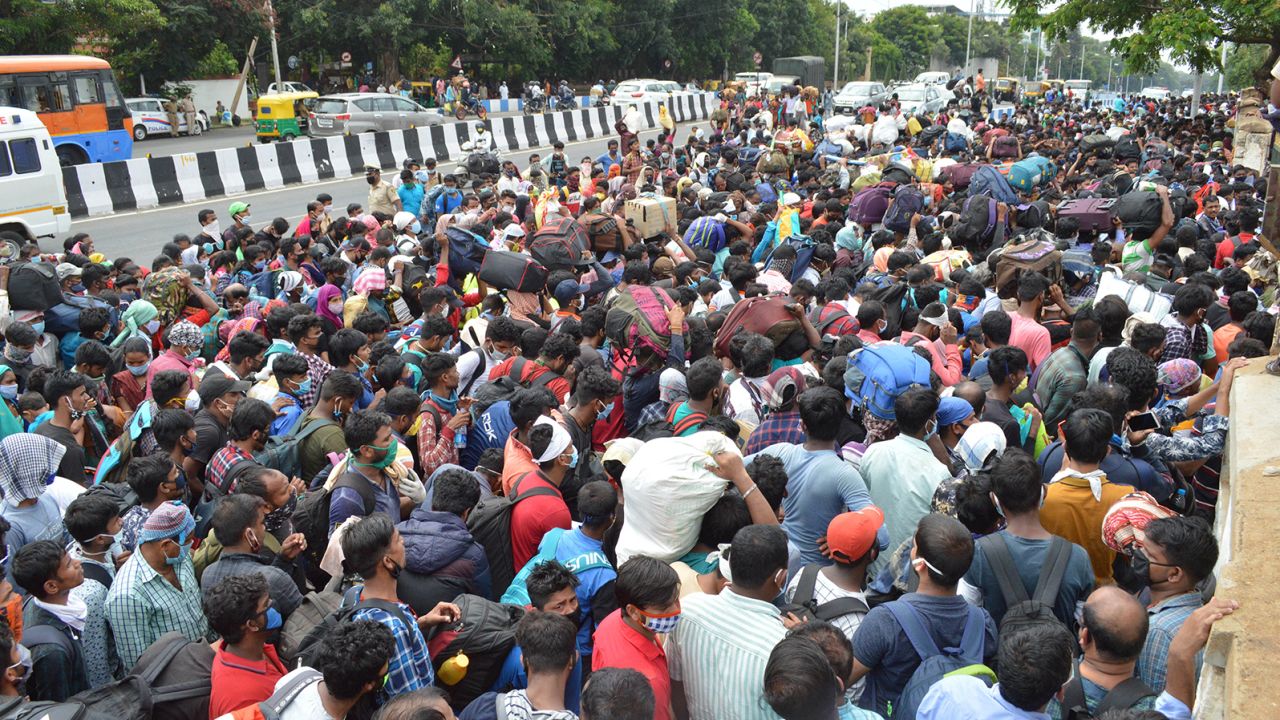 Migrant workers wait to board buses during the coronavirus lockdown in Bengaluru on May 23, 2020.  