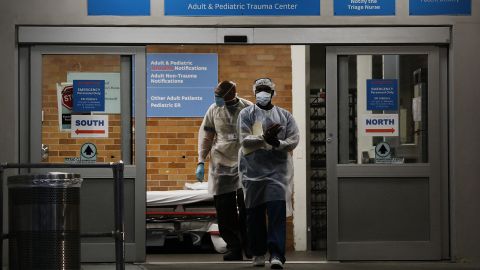 Medical workers walk last month outside a special coronavirus area in New York.