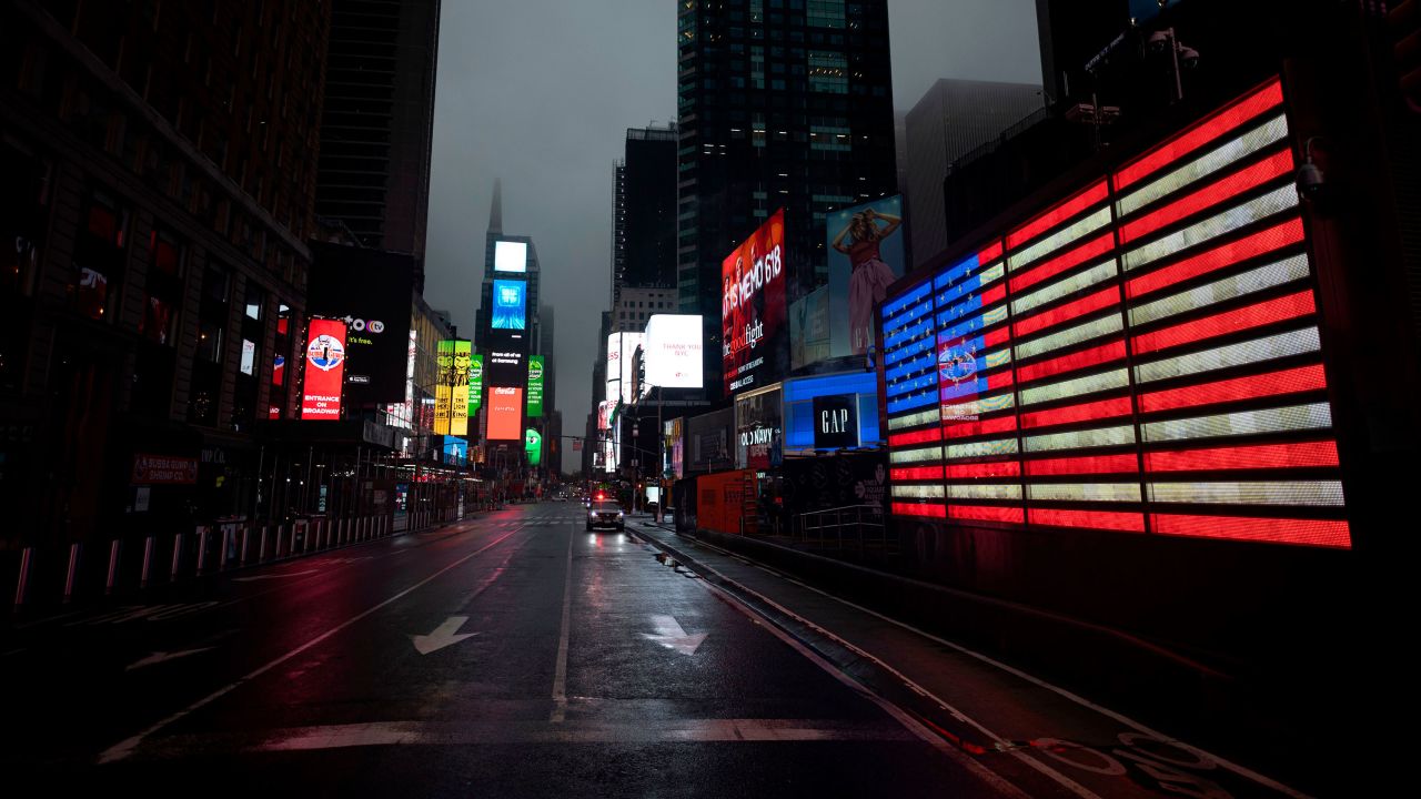 The American flag illuminates a street in Times Square amid the Covid-19 pandemic on April 30, 2020.