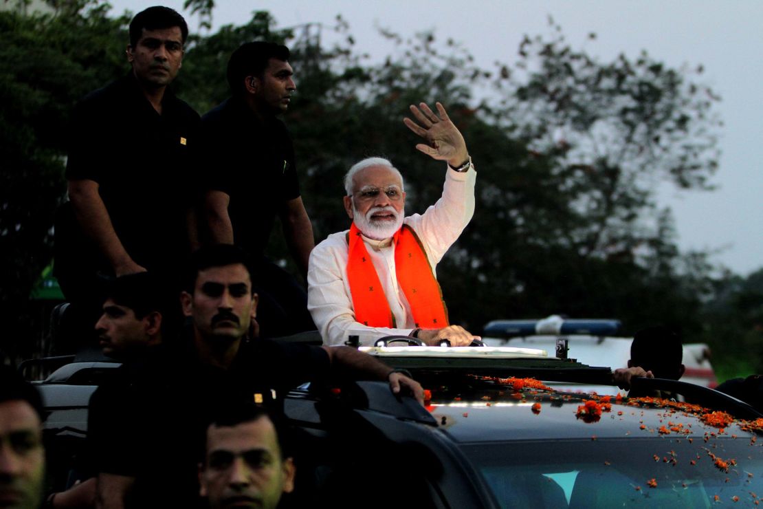 Indian Prime Minister Narendra Modi waves to supporters during his road show for election campaign in Bhubaneswar, India in April 2019. 