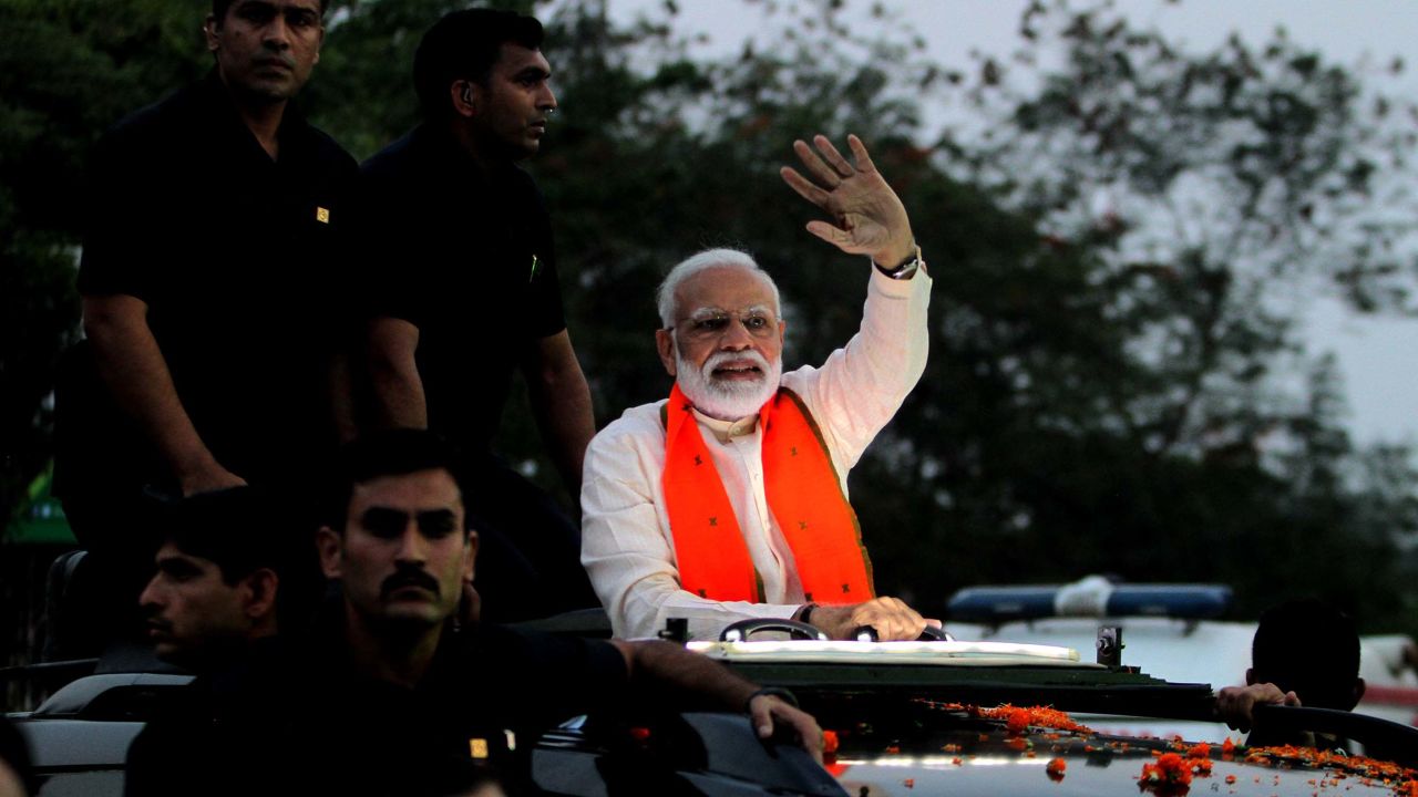 Indian Prime Minister Narendra Modi waves to supporters during his road show for election campaign in Bhubaneswar, India in April 2019. 