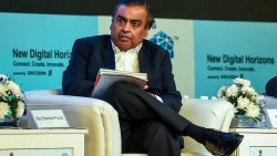 India's richest man and oil-to-telecom conglomerate Reliance Industries chairman Mukesh Ambani (R) attends the India Mobile Congress 2018 in New Delhi on October 25, 2018. - The second edition of the India Mobile Congress is taking place in New Delhi from 25-27 October. (Photo by CHANDAN KHANNA / AFP)        (Photo credit should read CHANDAN KHANNA/AFP via Getty Images)