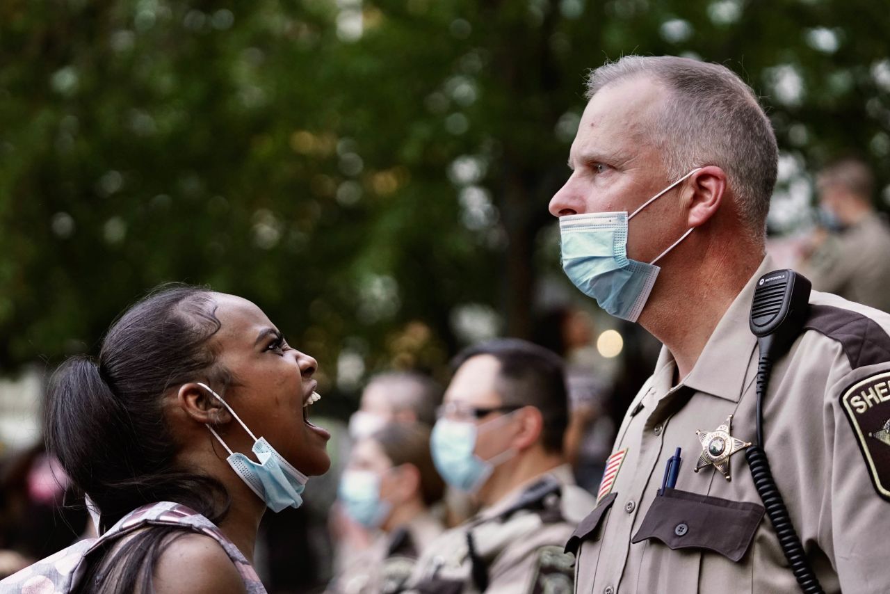 A woman yells at a sheriff's deputy during a protest in Minneapolis on May 28.