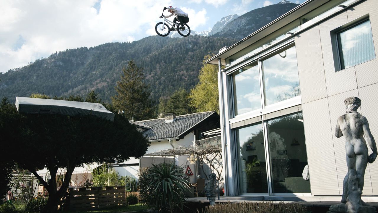 Wibmer jumps from the roof of his house onto a tree.