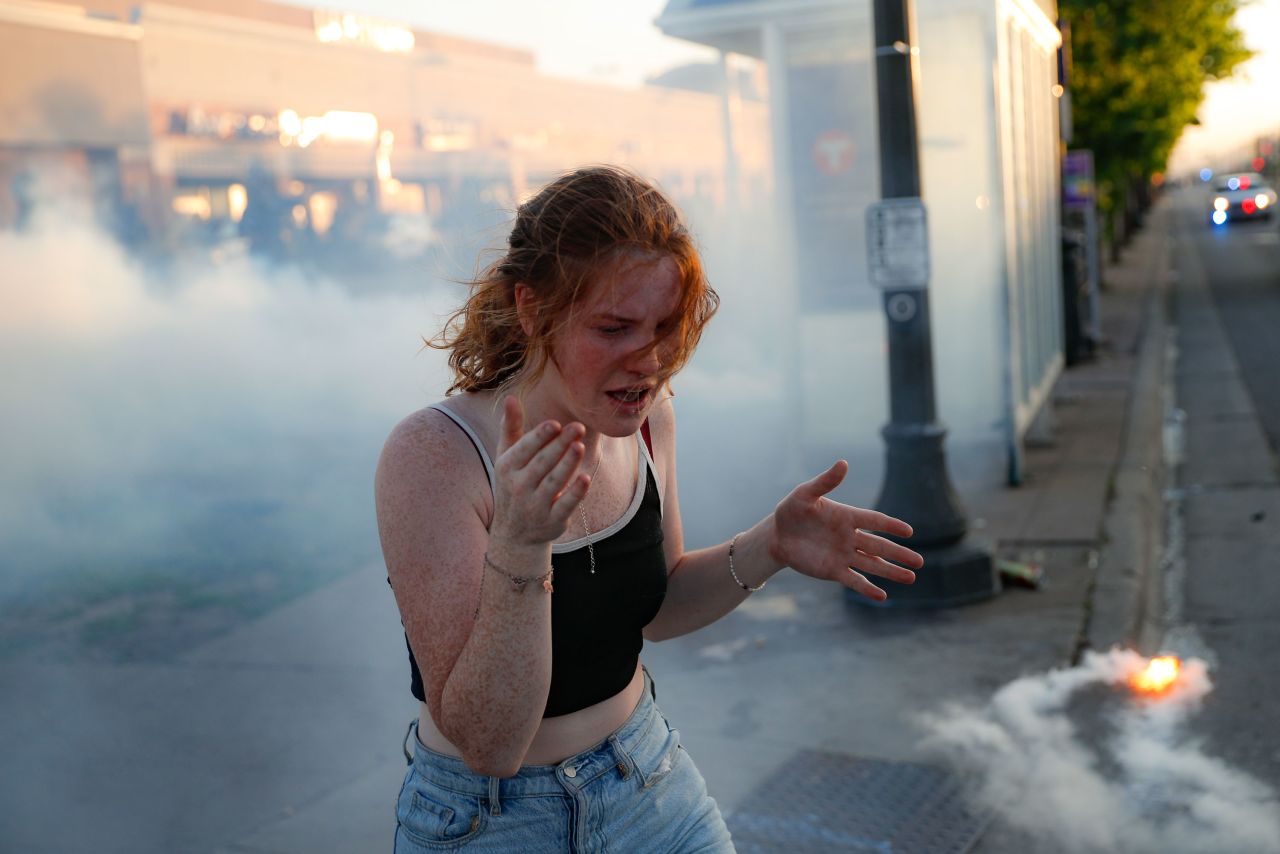 A protester reacts amid a cloud of tear gas in St. Paul on May 28.