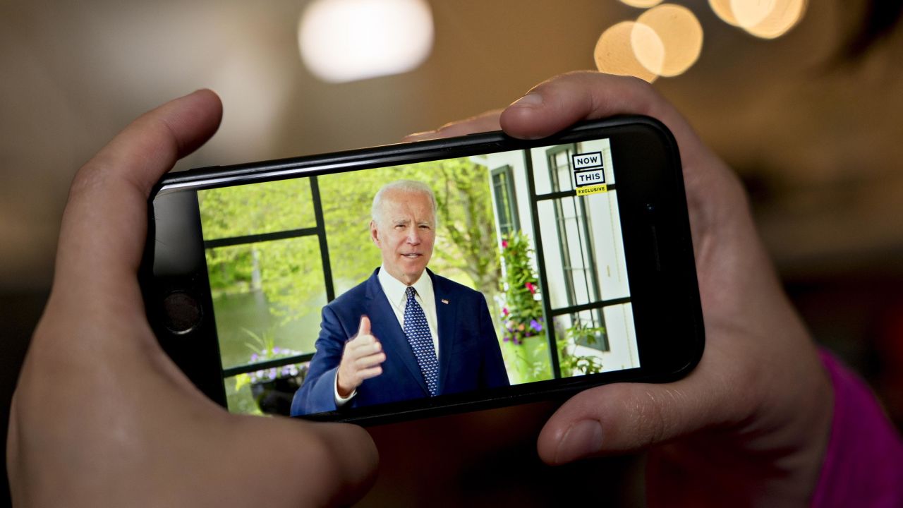 Former Vice President Joe Biden, presumptive Democratic presidential nominee, speaks during a NowThis economic address seen on a smartphone in Arlington, Virginia, 