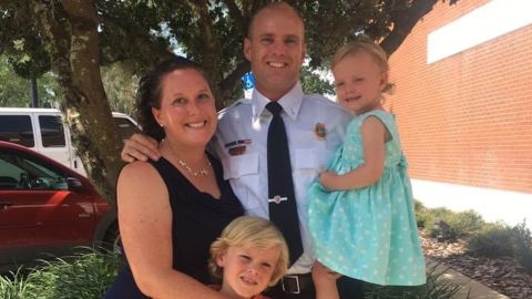 Carsten Kieffer poses with his family in 2017 after his promotion to lieutenant at the Tavares Fire Department in Florida. Kieffer, 41, says his citizenship interview got canceled in April due to the coronavirus pandemic. Now, he and thousands of others are in limbo.