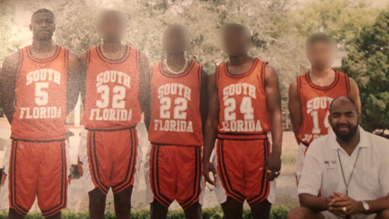George Floyd #5, (left) with other teammates and his coach, George Walker (far right)